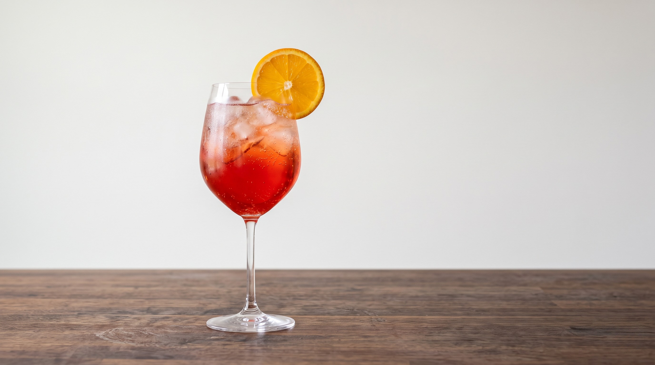Campari Spritz cocktail served in a Large wine glass