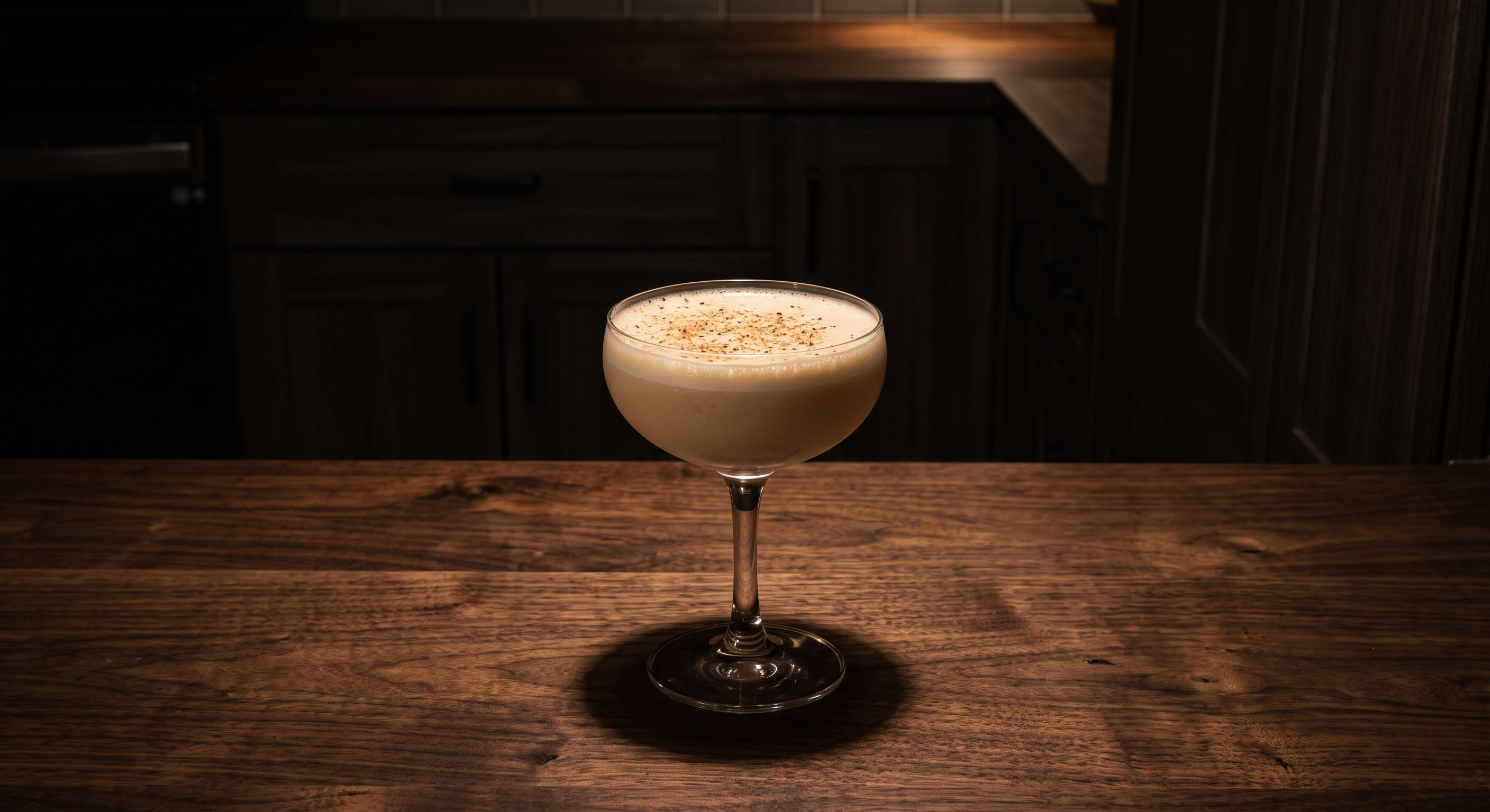 Death Flip cocktail served in a Small coupe glass.